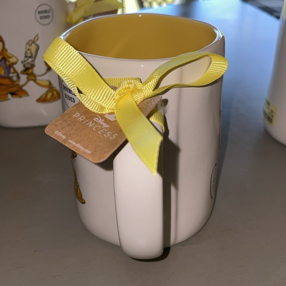 Rae Dunn Be Our Guest Mug with Cogsworth and Lumiere an the back - Picture 3 of 6